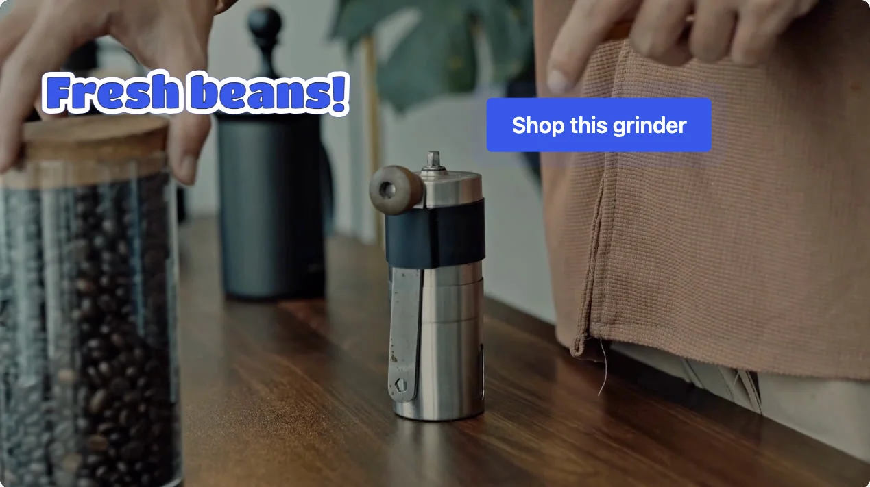 A video with two button hotspots: a "Fresh beans!" sticker and a "Shop this grinder" text button